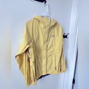 The North face women’s small yellow rain jacket coat.